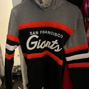 This is a Mitchell & Ness San Francisco Giants sweater.